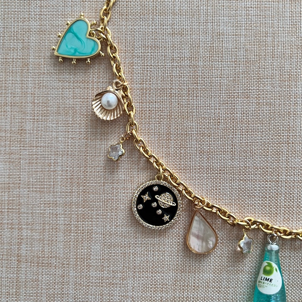 Very adorable charm necklace with gold chain - Picture 4 of 5